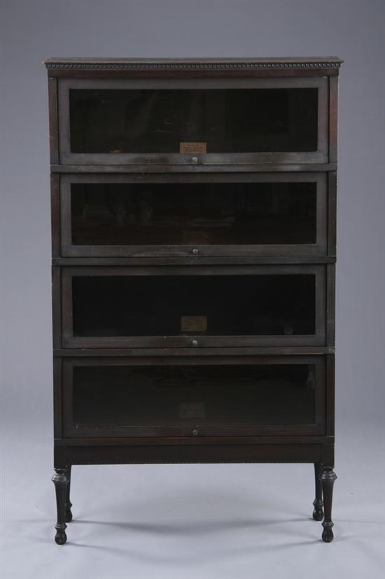 Appraisal: BARRISTER GLAZED-PANEL BOOKCASE th century ebonized mahogany Globe-Wernicke Molded-edge rectangular