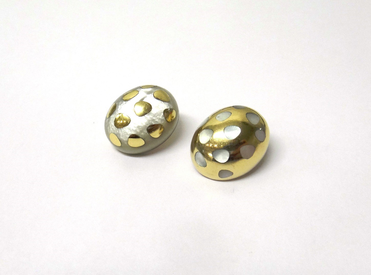 Appraisal: Two gold and mother of pearl earclips each of oval