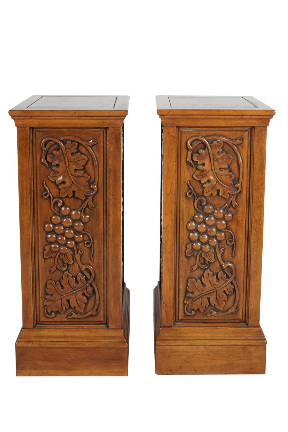 Appraisal: RAYMOND ENKEBOLL PAIR OF CARVED MAHOGANY PEDESTALSwith leaf grape motif