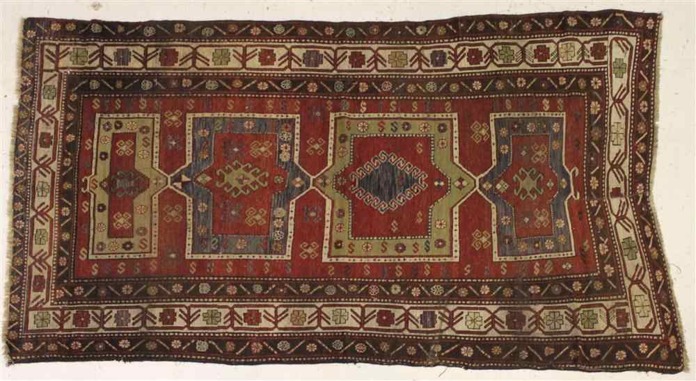 Appraisal: CAUCASIAN KAZAK TH CENTURY RUG red brown green blues and