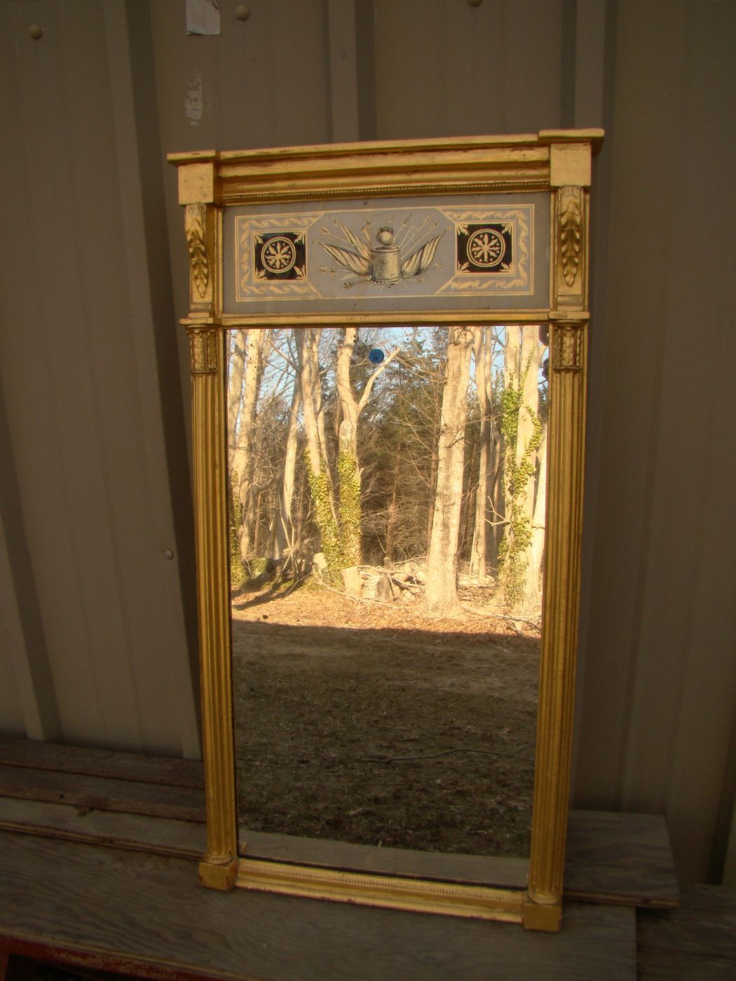 Appraisal: ANTIQUE SHERATON GILT MIRROR th CenturyReverse-painted upper glass tablet depicting