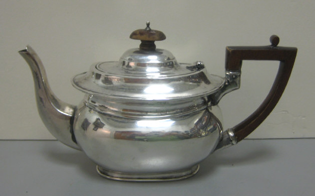 Appraisal: OLD SHEFFIELD PLATE TEAPOT Oval shape with hinged domed lid