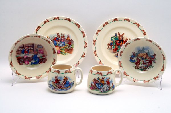 Appraisal: Two Royal Doulton three piece sets of children's dishes in