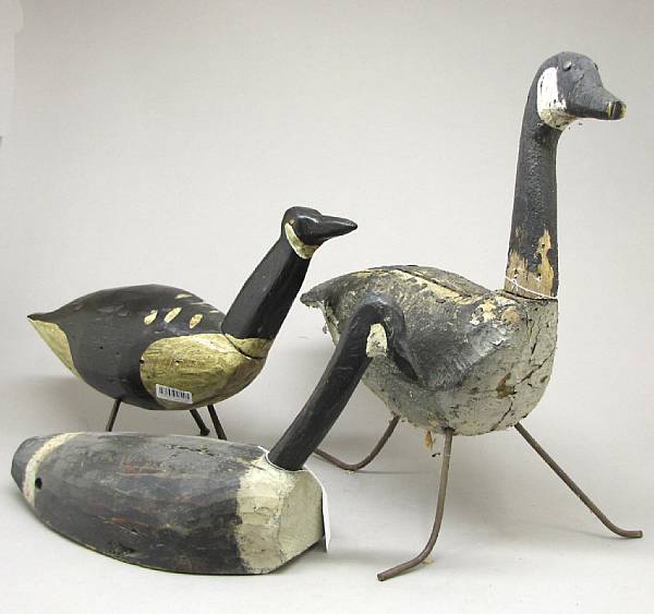 Appraisal: A group of three carved and painted wood goose decoys