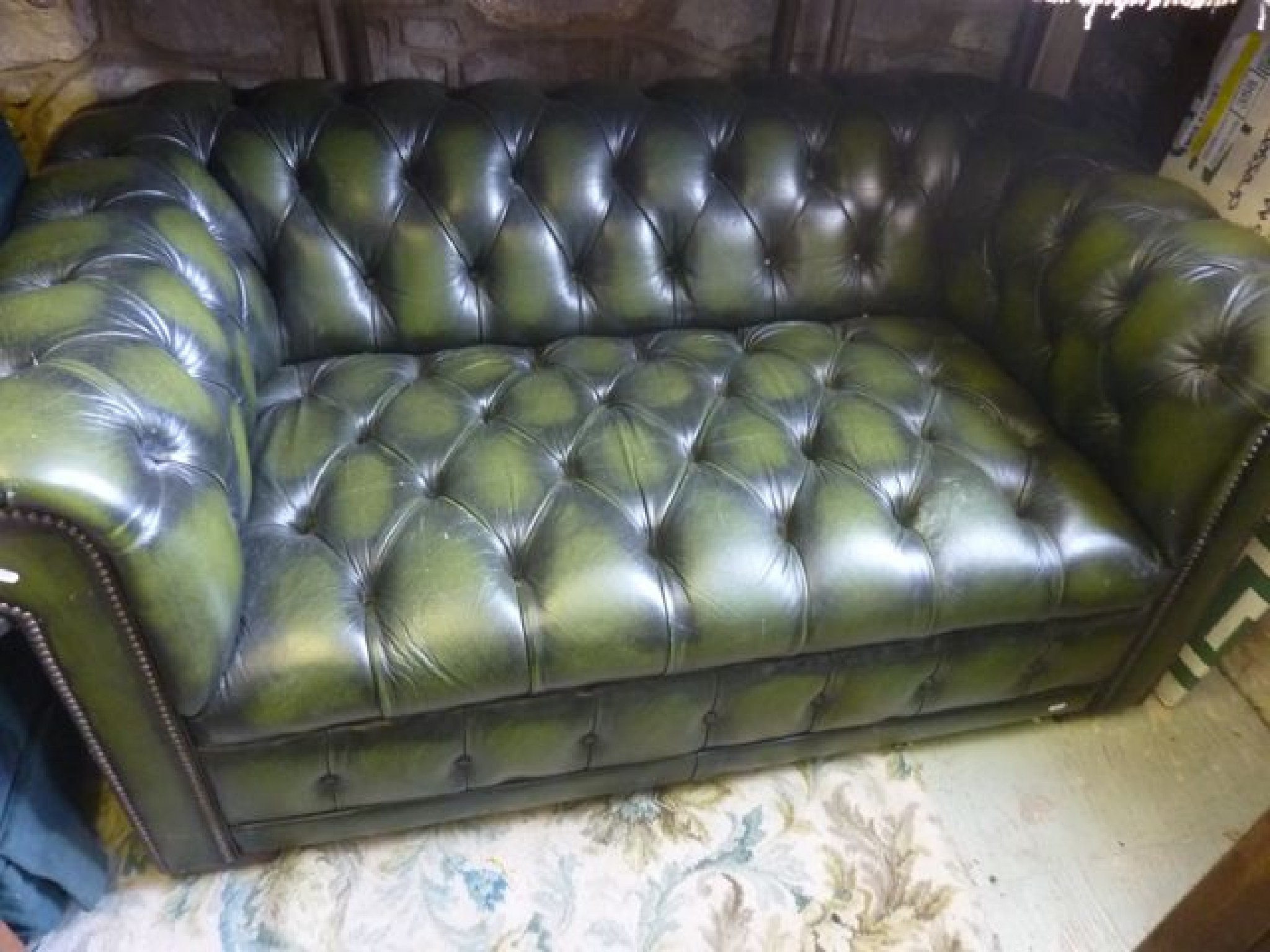 Appraisal: A contemporary -seat green leather and buttoned Chesterfield type sofa