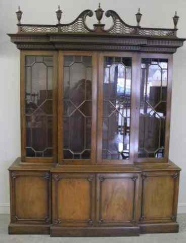 Appraisal: Georgian Style Mahogany Breakfront With adjustable shelves and pierced crest