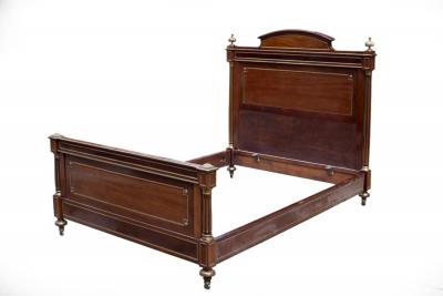 Appraisal: An Empire mahogany parcel gilt bed with turned taper columns