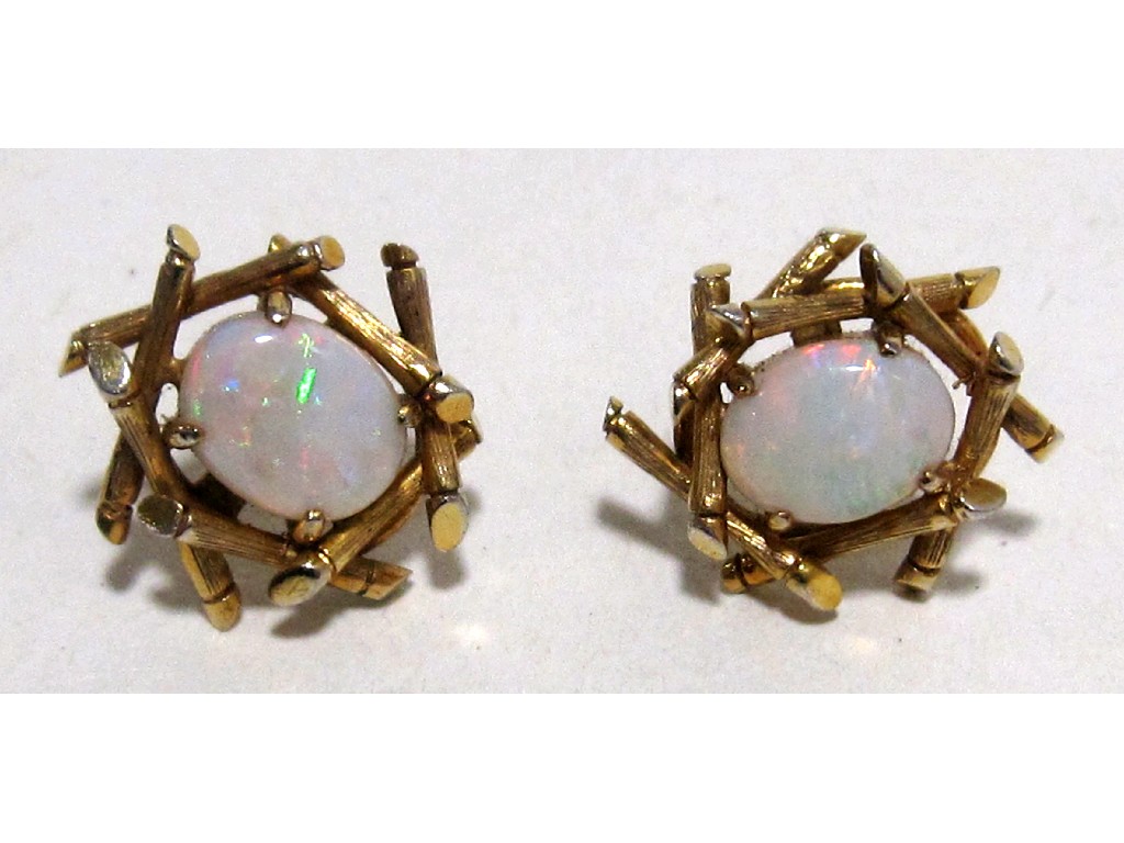 Appraisal: Nine carat gold mounted opal stud earrings