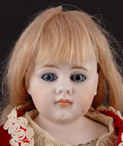 Appraisal: BISQUE SHOULDER HEAD DOLL Open blue glass eyes closed mouth