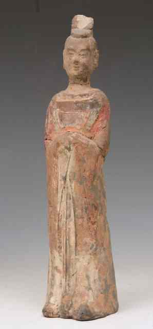 Appraisal: A CHINESE UNGLAZED POTTERY FIGURE OF A STANDING OFFICIAL Tang