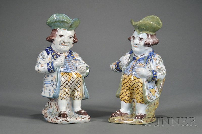 Appraisal: Two Similar French Faience Snuff-taker Toby Jugs France th century