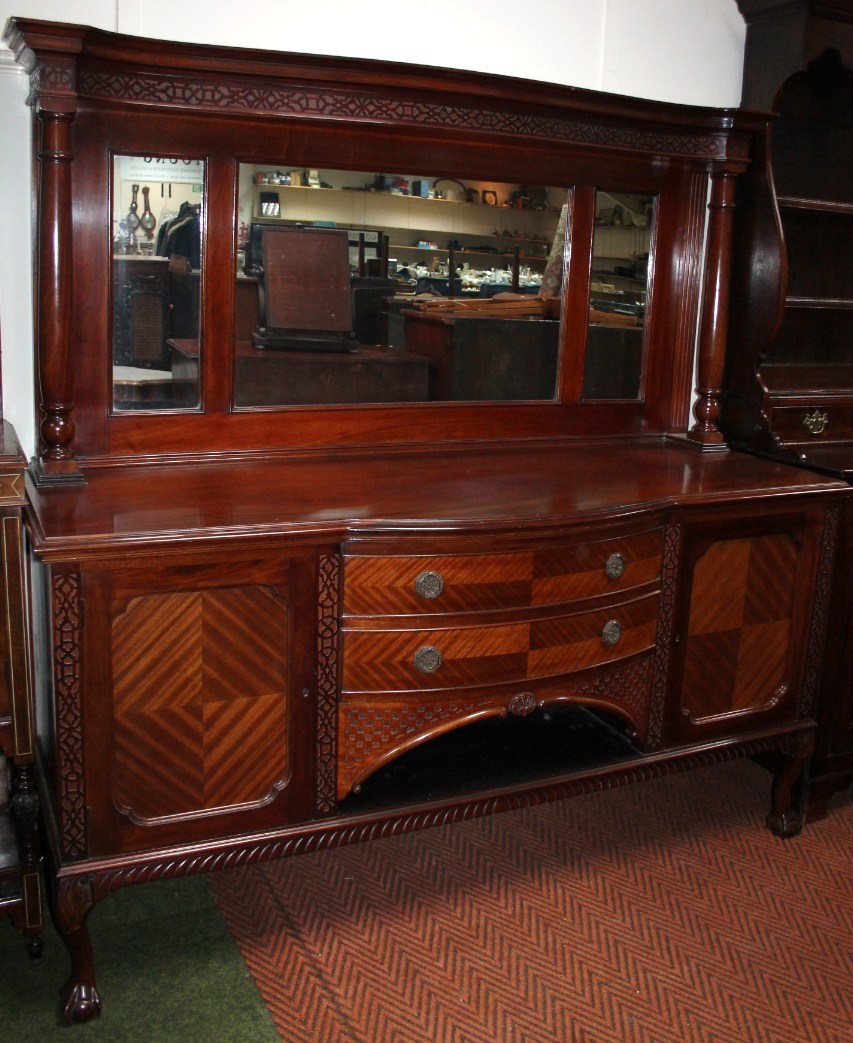 Appraisal: A late Victorian mahogany and walnut mirror back sideboard the