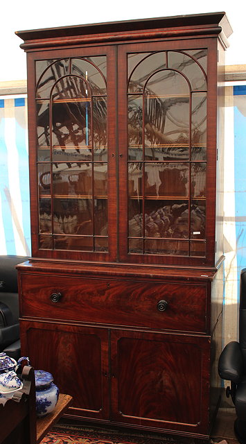 Appraisal: A TH CENTURY MAHOGANY SECRETAIRE BOOKCASE with twin astragal glazed