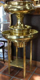 Appraisal: Monumental Moderne brass footed jardiniere in the Neoclassical taste rising