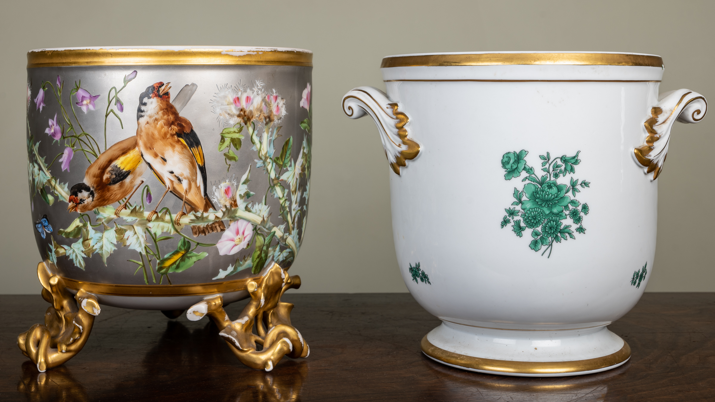 Appraisal: A continental porcelain jardiniere the silver ground decorated with goldfinches