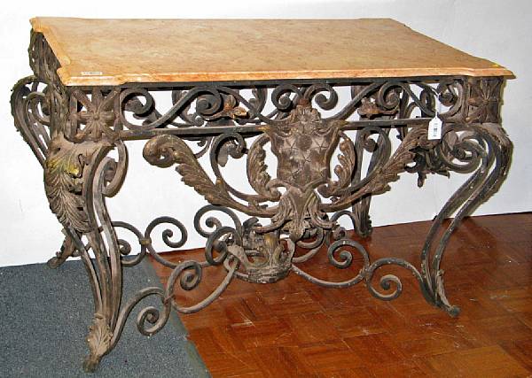 Appraisal: A Baroque style wrought iron marble top center table modern