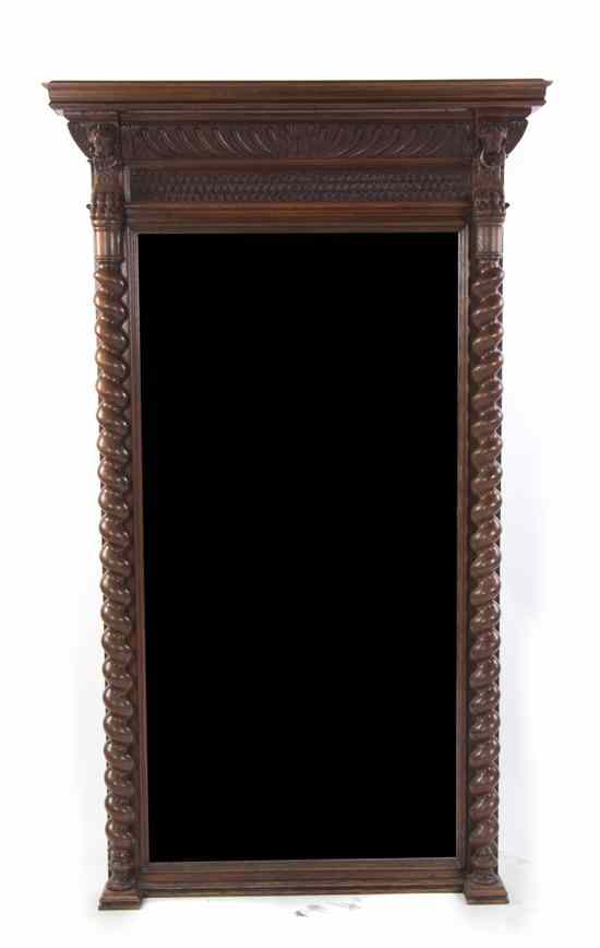 Appraisal: A Jacobean Mahogany Mirror having a molded cornice above the