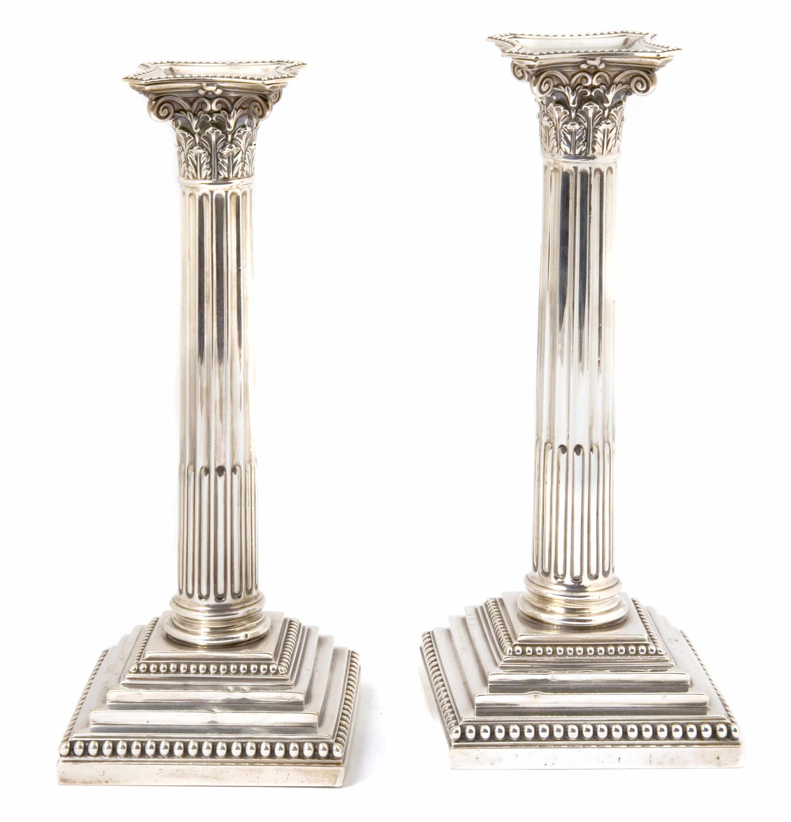 Appraisal: A pair of Victorian sterling silver columnar candlesticks Hawksworth Eyre