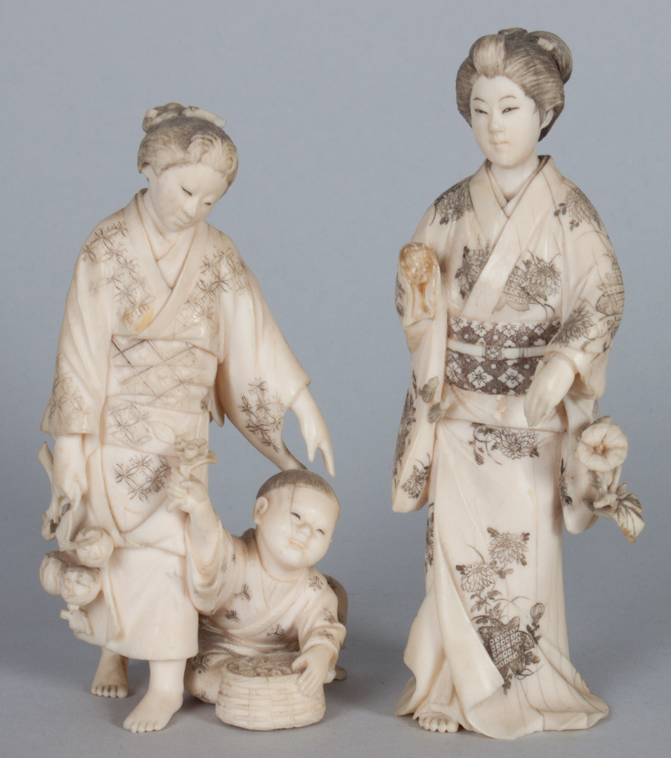 Appraisal: Two Japanese carved ivory figures Mother and child group and