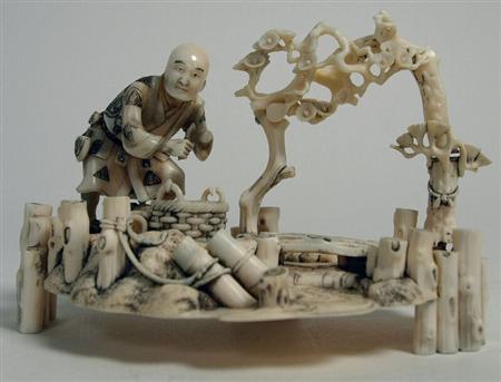 Appraisal: A Japanese ivory okimono of a fisherman Meiji period depicted