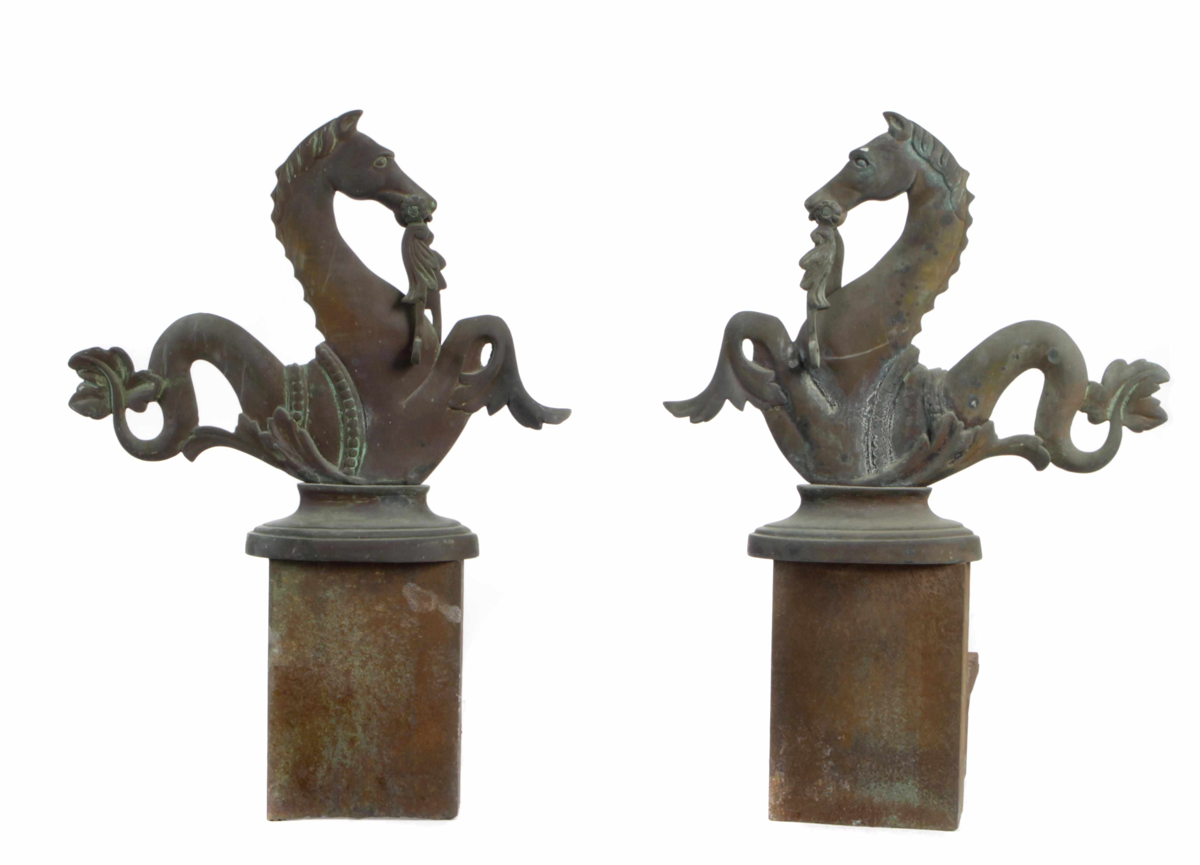 Appraisal: A pair of patinated metal 'seahorse' andirons height in