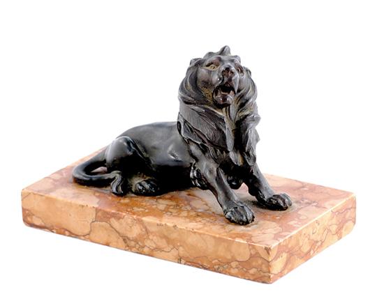 Appraisal: Bronze and marble lion-form inkwell late th century recumbent lion