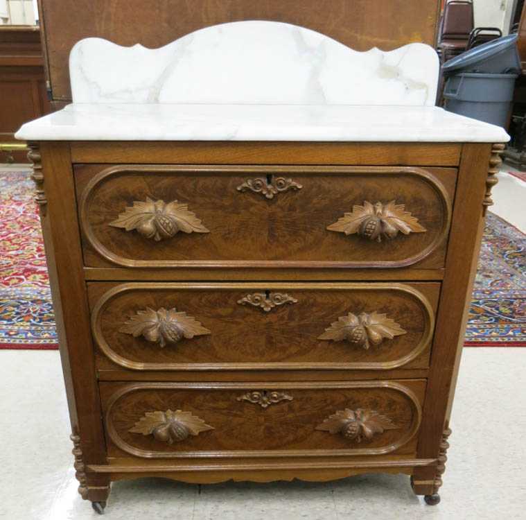 Appraisal: A VICTORIAN MARBLE-TOP WALNUT WASHSTAND American c having a rectangular