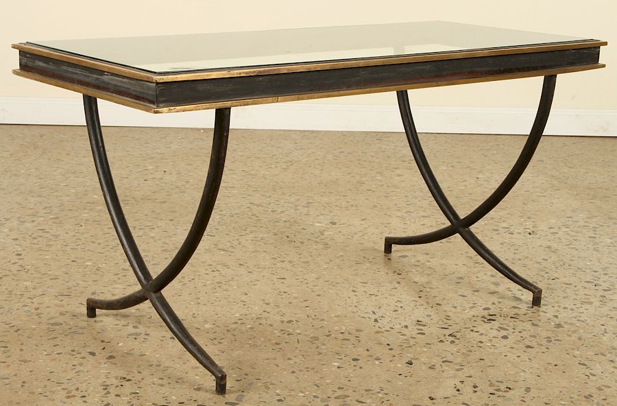 Appraisal: FRENCH IRON COFFEE TABLE MANNER ANDRE ARBUS A French iron