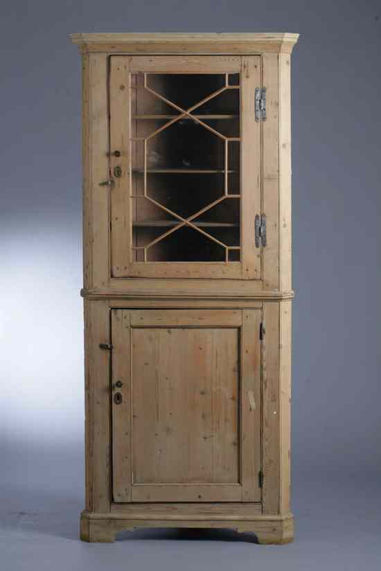 Appraisal: GEORGE III STYLE STRIPPED PINE CORNER CUPBOARD in one part