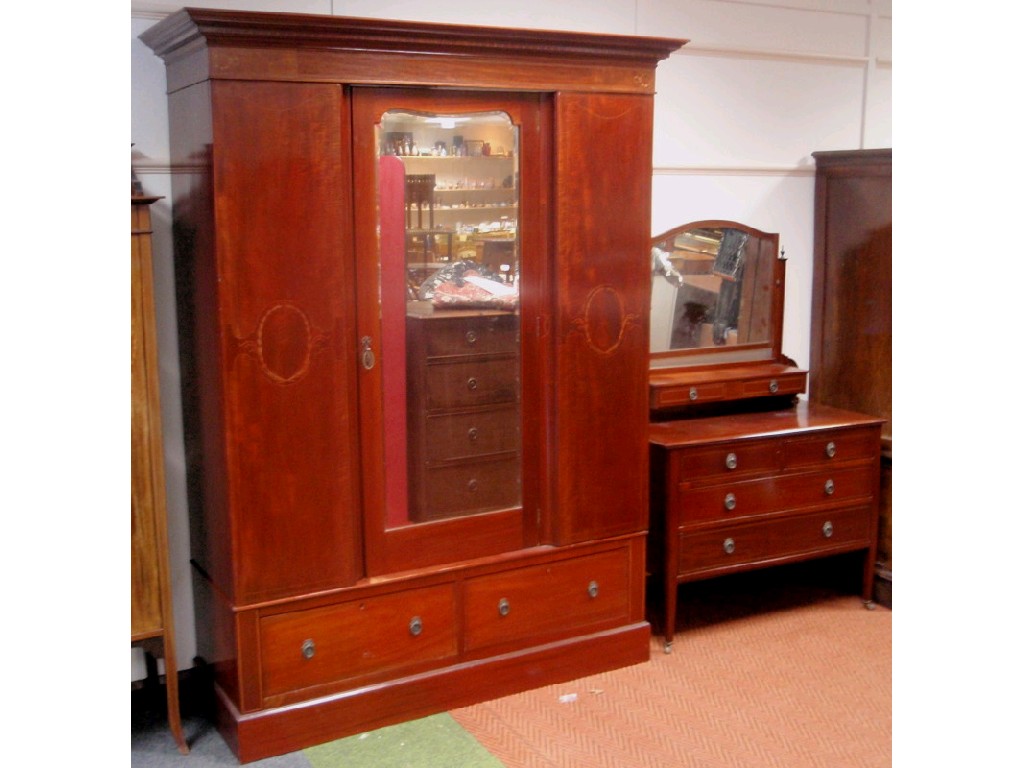 Appraisal: An Edwardian string inlaid mahogany wardrobe and dressing table the