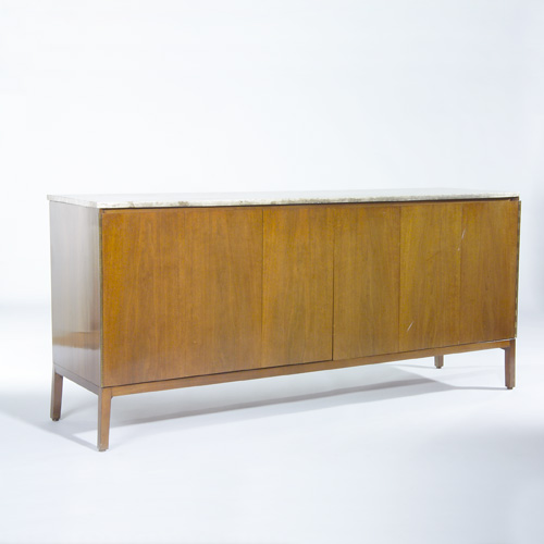 Appraisal: PAUL McCOBB Credenza with travertine top over two tri-fold doors