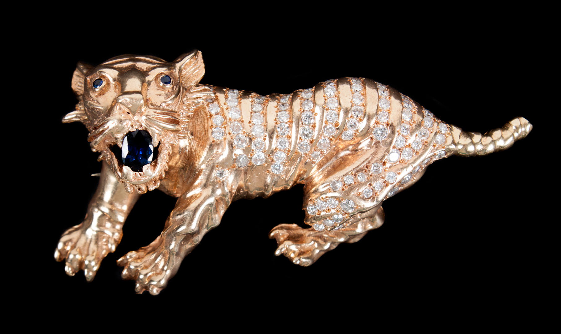 Appraisal: K gold diamond sapphire tiger pendant brooch in W grams