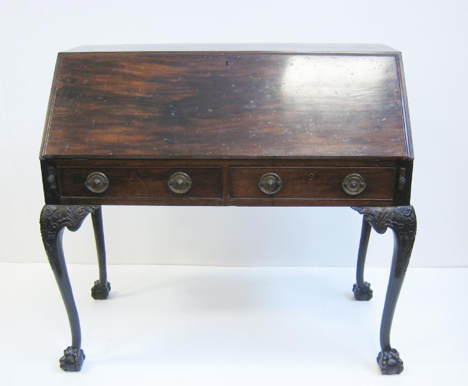 Appraisal: A late Georgian mahogany Standing Bureau the sloping fall revealing