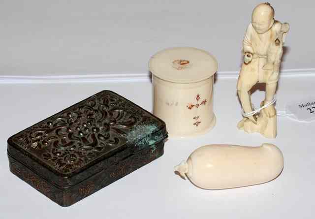 Appraisal: A CARVED IVORY OKIMONO of a fisherman holding two fish