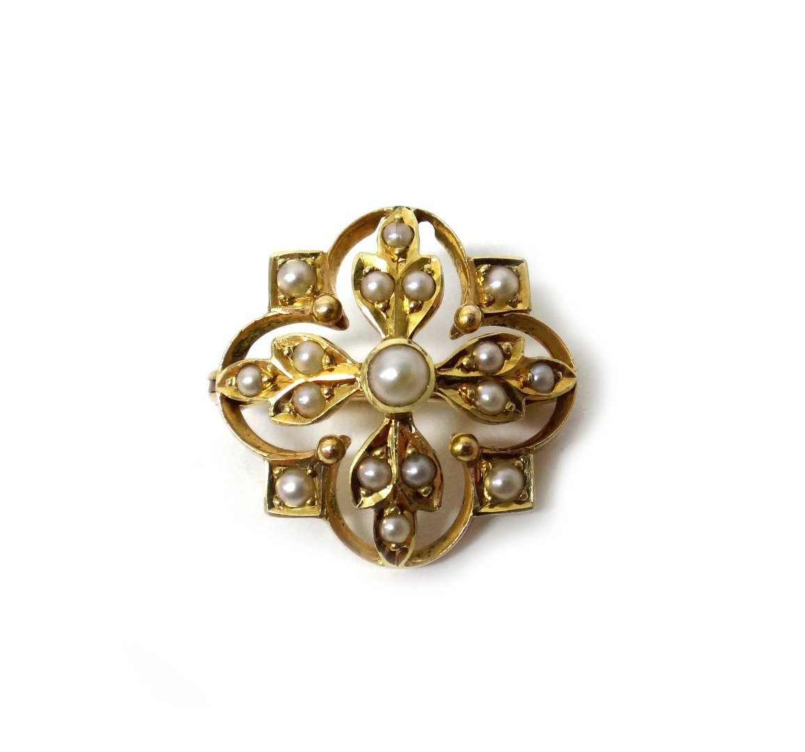 Appraisal: A gold and seed pearl set pendant brooch in a