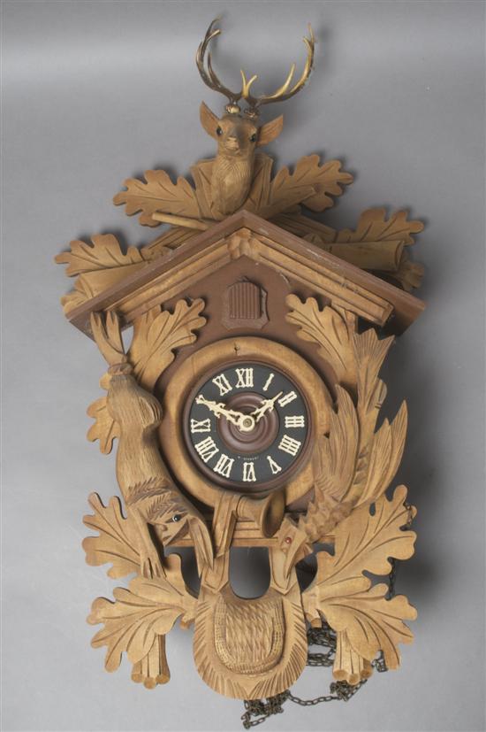 Appraisal: A Black Forest Type Carved Wall Clock Depicting the Hunt