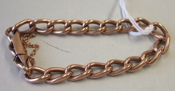 Appraisal: A gold curb link bracelet on a snap clasp fitted