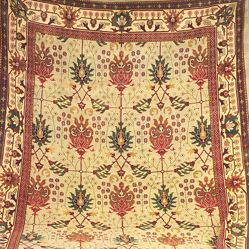 Appraisal: WILLIAM MORRIS STYLE Rug with pomegranate and fern motif in