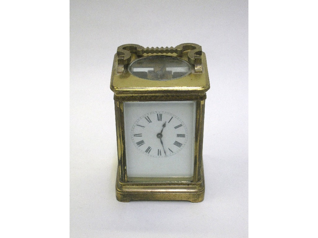 Appraisal: Brass cased carriage clock with white enamel dial and roman