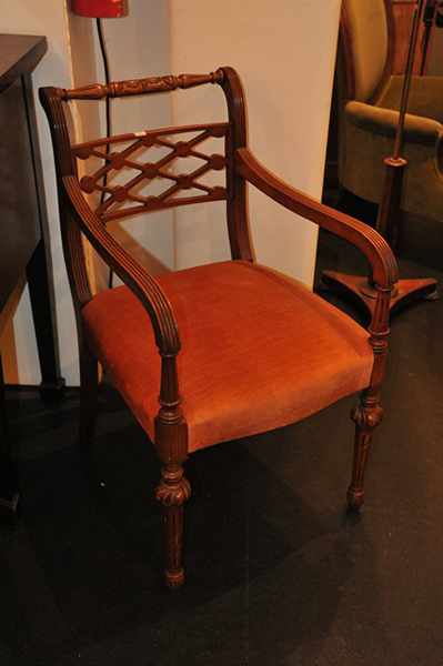 Appraisal: A PAIR OF REGENCY STYLE CARVERS UPHOLSTERED IN BURNT ORANGE