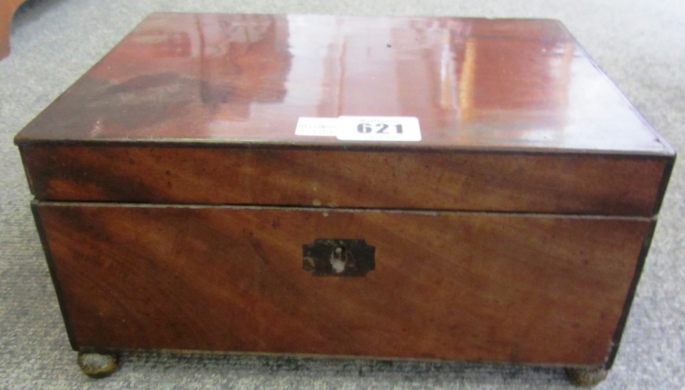 Appraisal: A Regency mahogany rectangular lift top sewing box on leaf