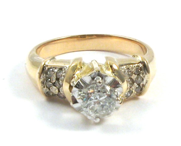 Appraisal: DIAMOND AND TEN KARAT GOLD RING centering a round-cut diamond