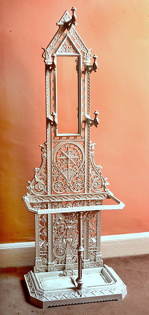 Appraisal: A CAST IRON VICTORIAN STYLE HALL STAND with inset mirror