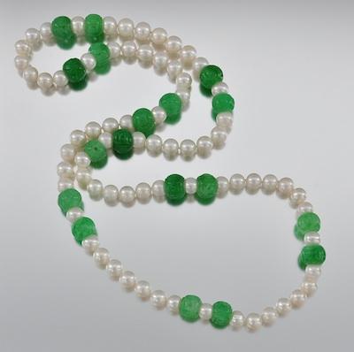 Appraisal: A Carved Jadeite Bead and Pearl Necklace The necklace is