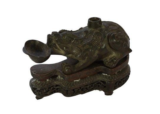 Appraisal: A Chinese bronze water dropper or brush washer in the