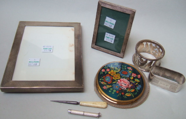 Appraisal: A silver mounted oak rectangular photograph frame with engine turned