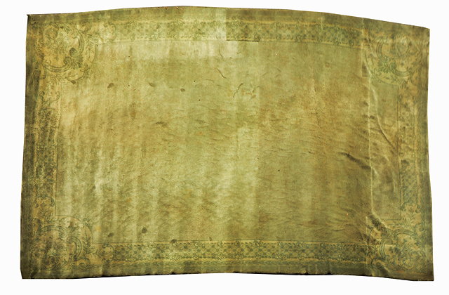 Appraisal: A LARGE GREEN SAVONNERIE CARPET with plain central field within