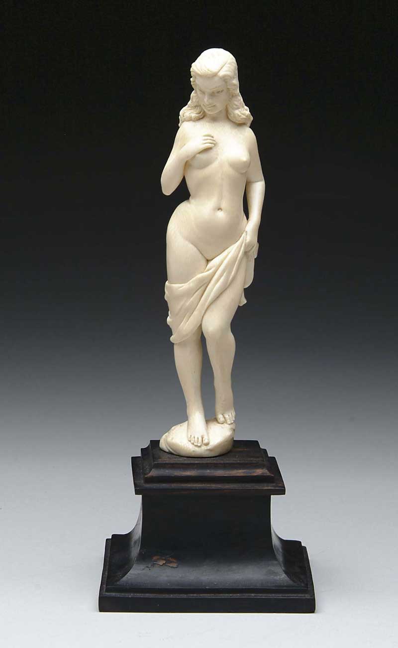 Appraisal: CARVED IVORY FIGURE OF A NUDE WOMAN The standing nude