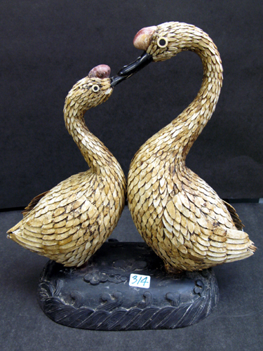 Appraisal: PAIR OF ASIAN CARVED BONE FIGURES OF DUCKS on a