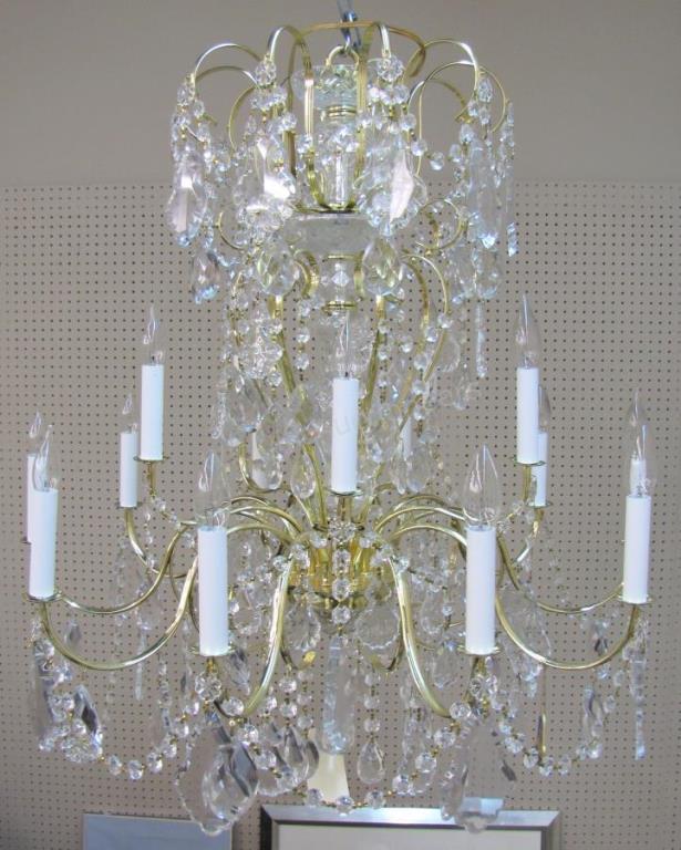 Appraisal: A Schonbek crystal chandelier brass frame light with crystal prisms